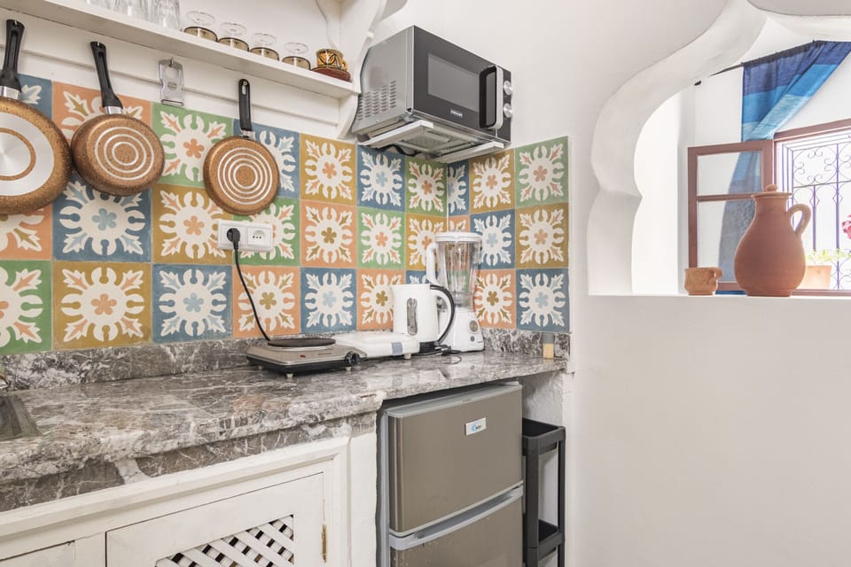 The open kitchen seamlessly integrates with the living space, perfect for entertaining friends and family.