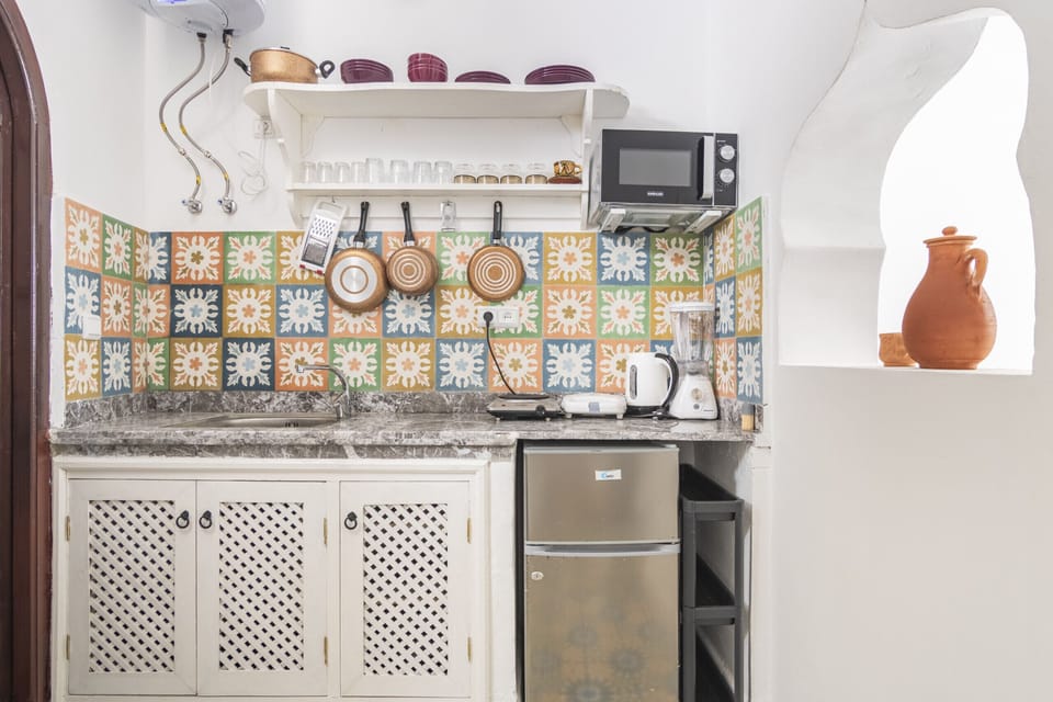 The open kitchen seamlessly integrates with the living space, perfect for entertaining friends and family.