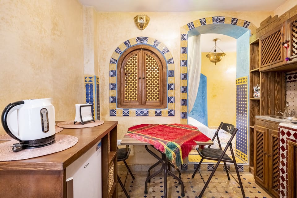Charming dining nook. Enjoy meals together at this unique table with two chairs.