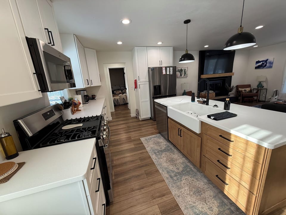 Modern Kitchen open to Living area to visit with guests. 