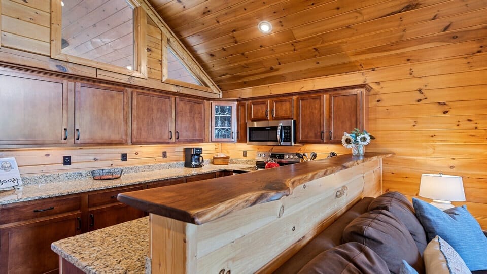 Livev edge walnut bar top between kitchen and main living area