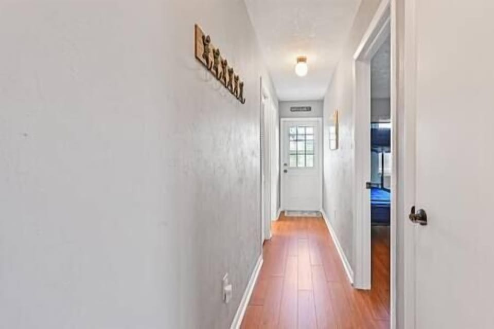 Hallway to 2 bedrooms and second bathroom