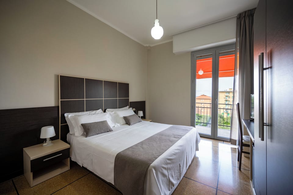 Standard Double Room | Minibar, in-room safe, desk, blackout drapes