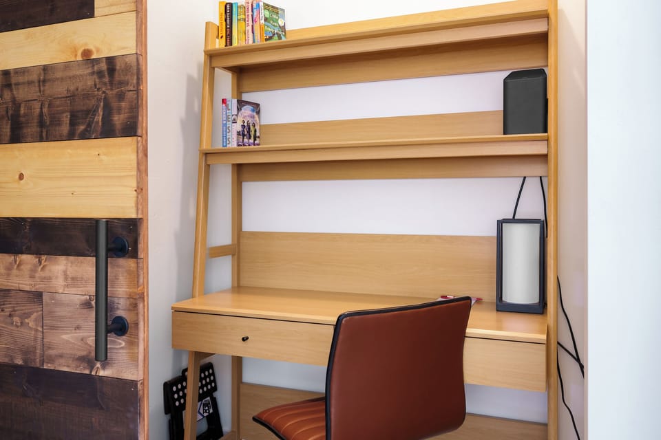 Work space with sliding barn door to allow privacy on the main level