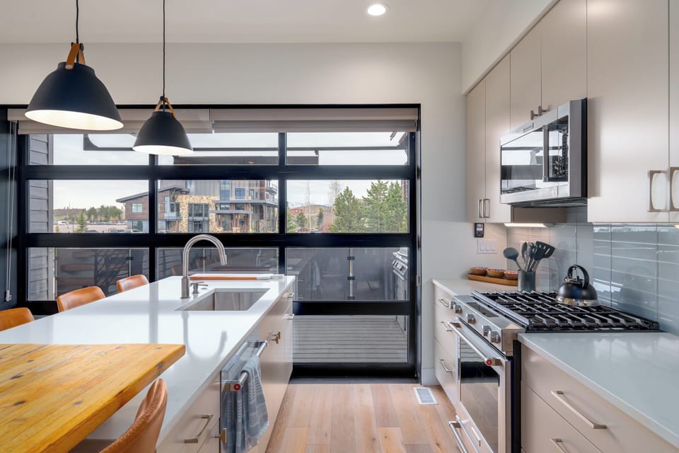 The glass garage door allows light to flow into the main level living space.