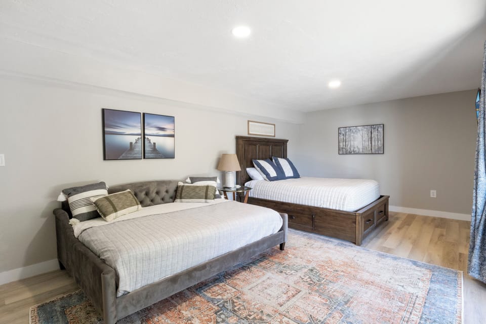 Blended king lakefront suite offers a king bed and full futon with lakeview and patio access