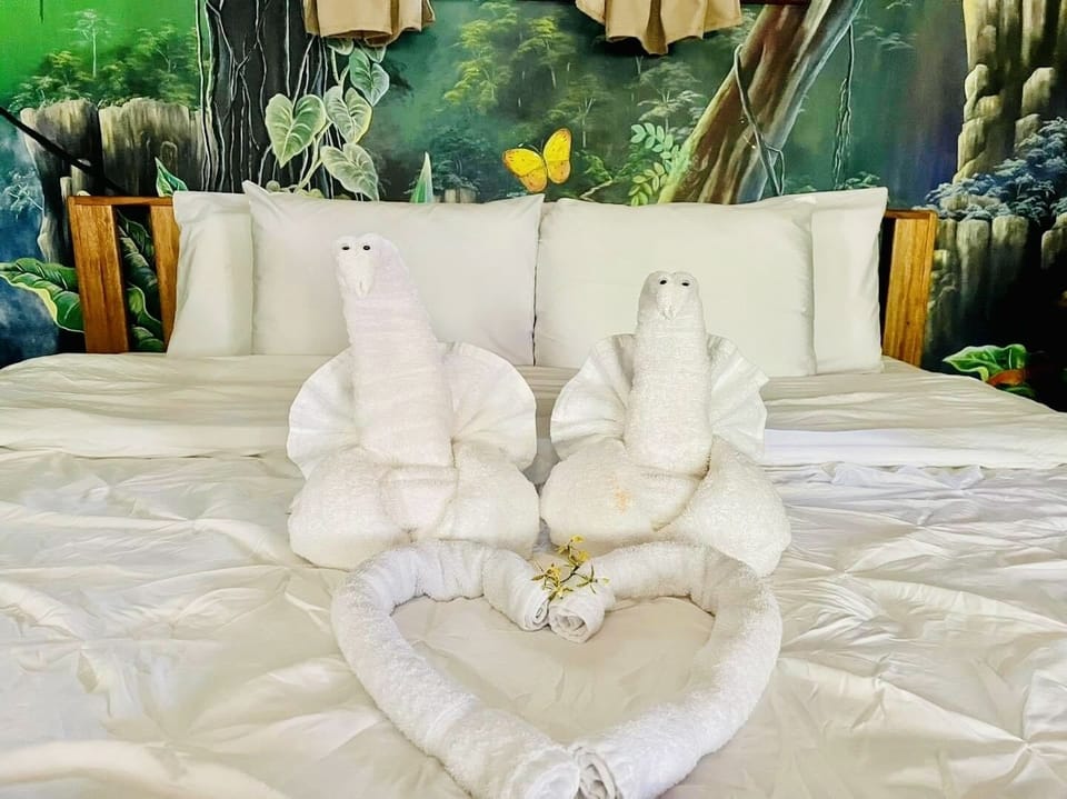 Mariposa Deluxe Executive Suite | Premium bedding, in-room safe, individually decorated, laptop workspace