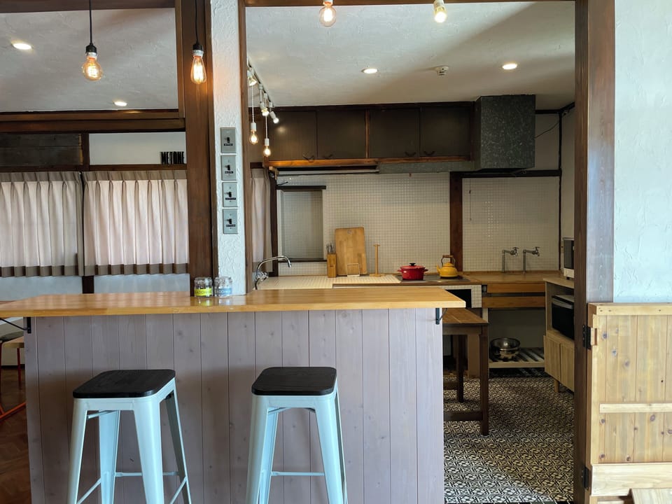 Full-size fridge, microwave, stovetop, rice cooker