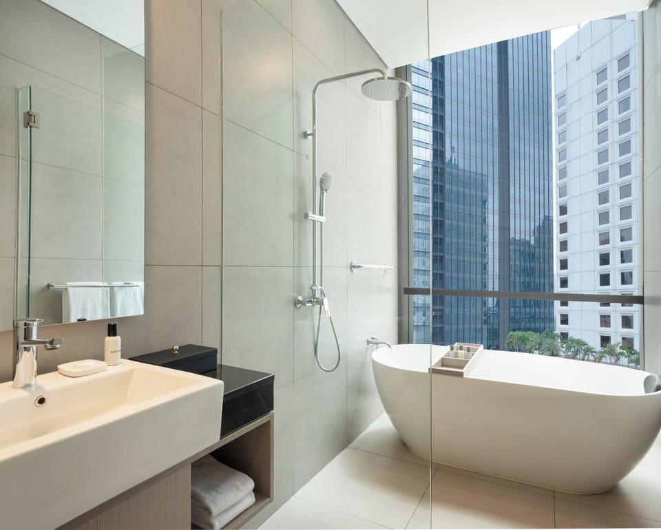 Separate tub and shower, rainfall showerhead, free toiletries