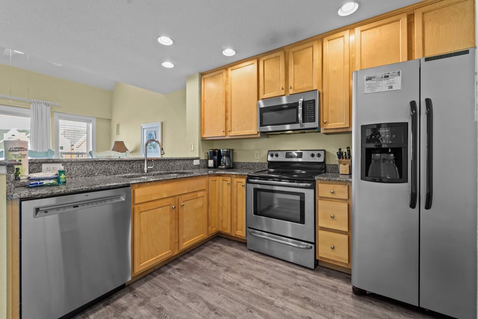 Kitchen Area with Two Bar Seats on Third Level