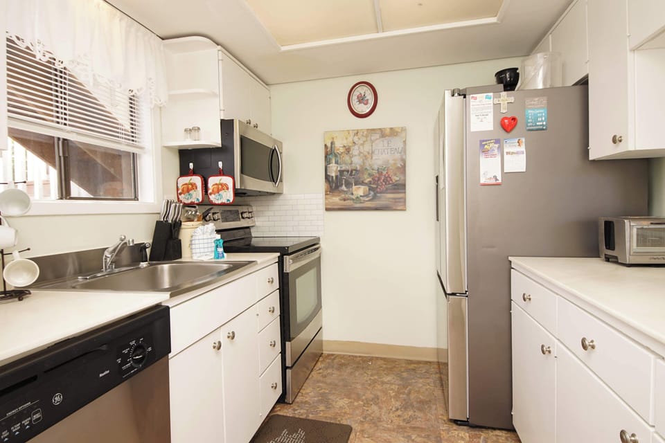 Your fully equipped kitchen features modern appliances and everything you need to create memorable meals during your stay.