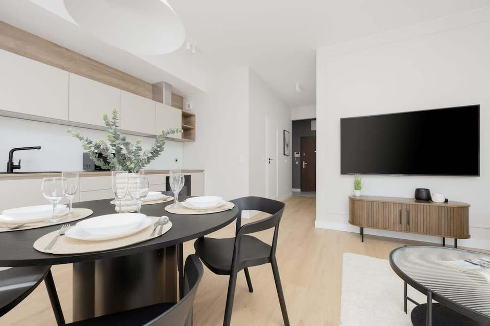 Living room with dining table and chairs.