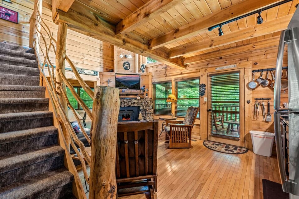 The stairs to the upstairs loft area are located just inside the front door.