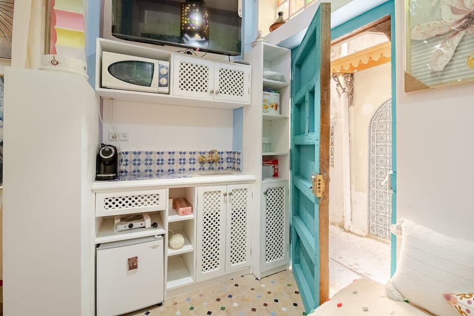 Prepare a delicious meal in the well-equipped kitchenette, featuring modern stainless steel appliances.