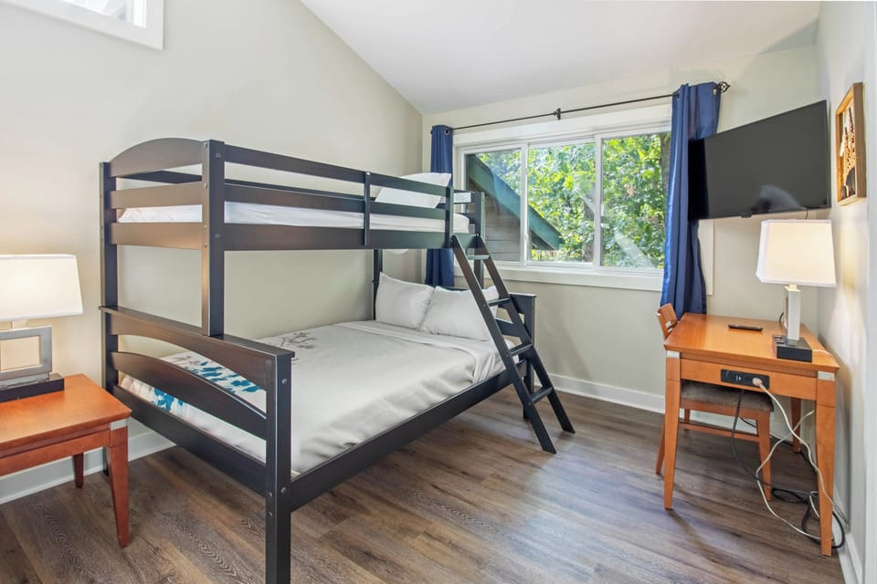 Bedroom 2 includes one twin over full bunk bed and a television