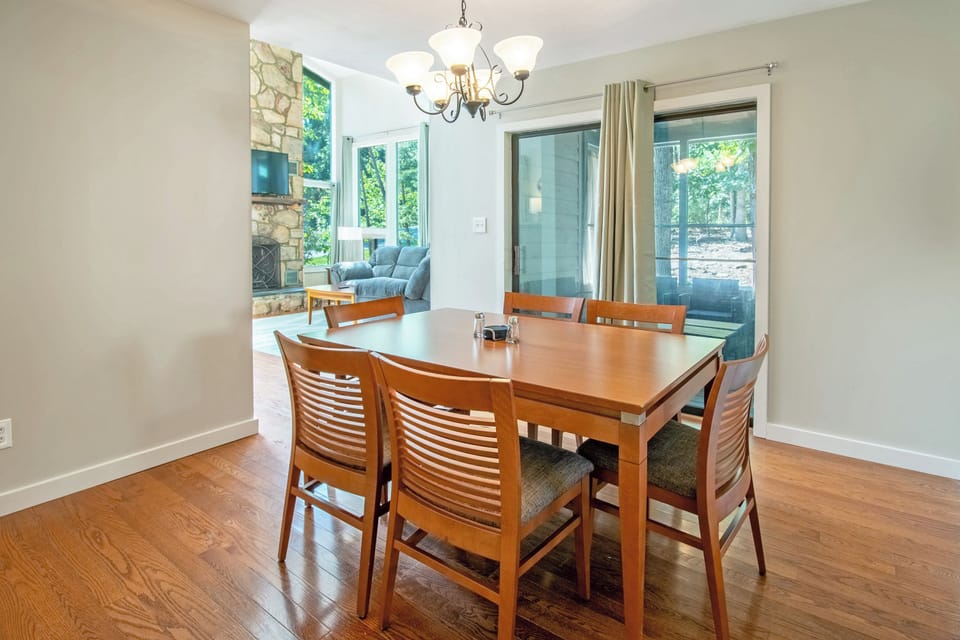 Dining area with seating for 6 and access to screened porch