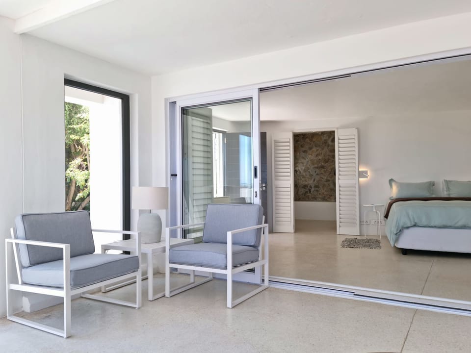 The living room with direct access into the bedroom