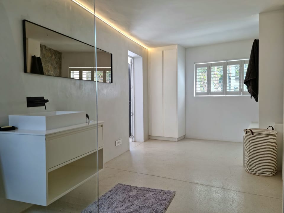 The bathroom with a shower