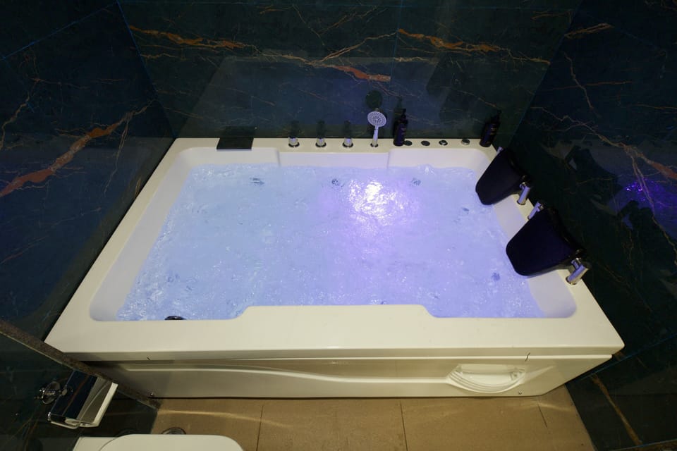 Superior Room | Bathroom | Hair dryer, slippers, soap, shampoo