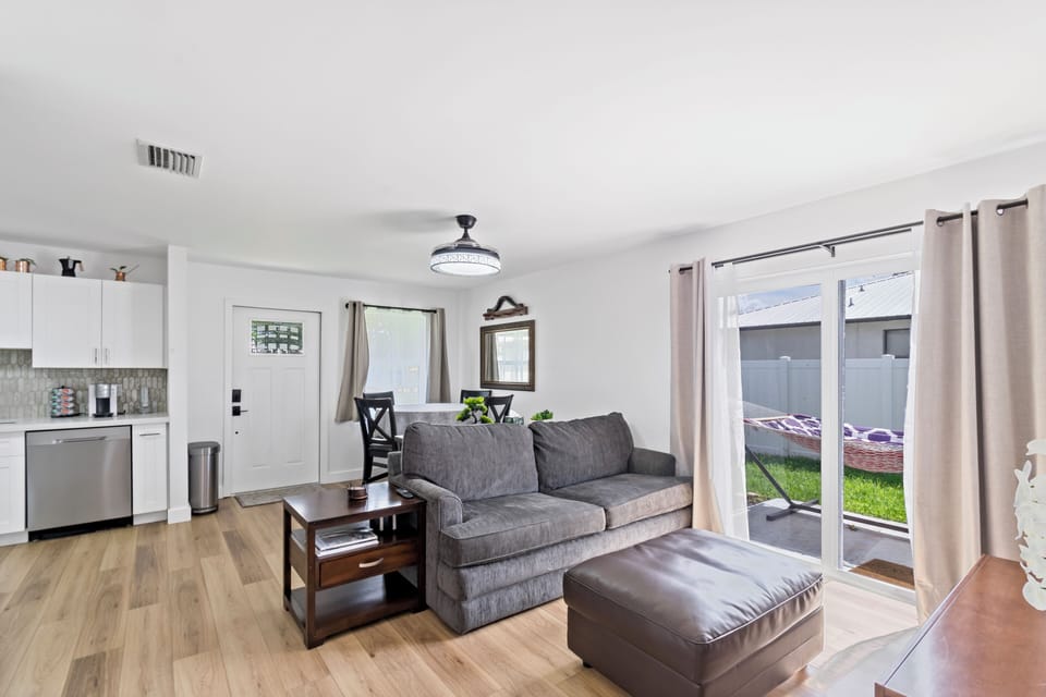 SUPER comfy couch!
Sliding glass doors lead to private backyard.