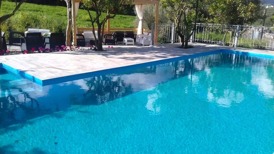Unwind in the serene swimming pool, ideal for relaxation and rejuvenation