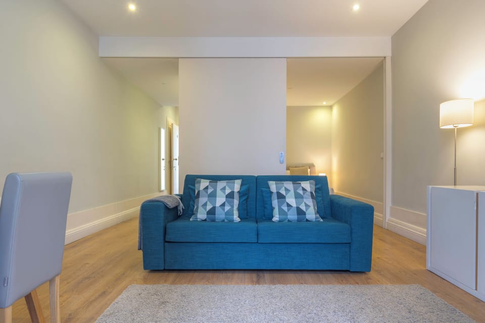 Deluxe Apartment | Living area | Flat-screen TV