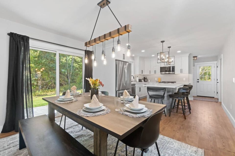 Large Kitchen table with seating for 6.  Enjoy your meals at this table as well as the many games we have left for your enjoyment!