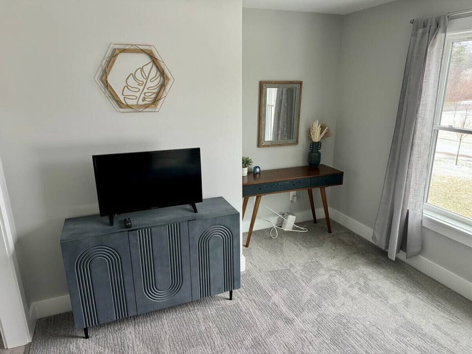 32` smart tv and desk in flex room. A perfect space to get away and take care of some work while on vacation.