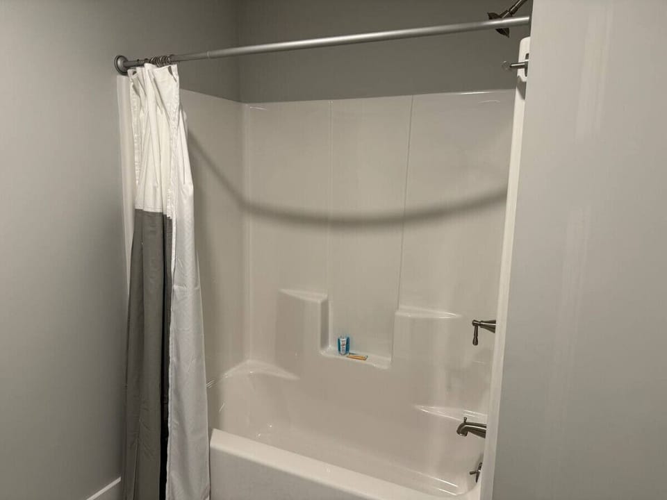 Full Bathroom with Tub/Shower Combo conveniently located next two bedrooms and main living area.