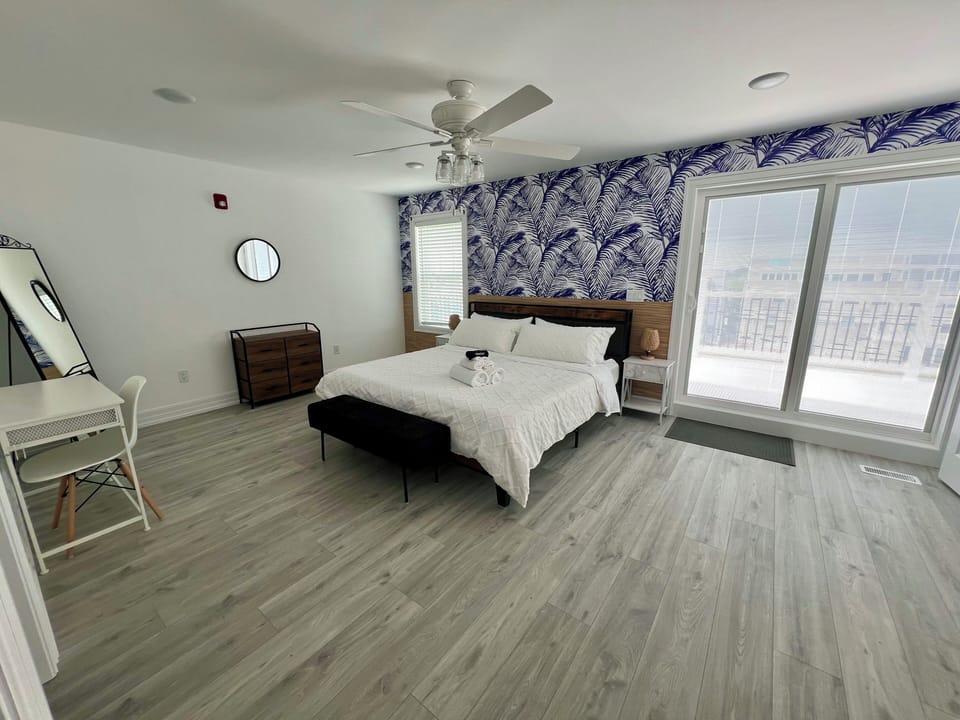 Master Bedroom with walk in closet and private bathroom with access to roof deck