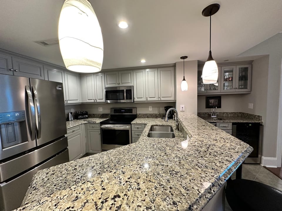 Modern kitchen with granite countertops and stainless steel appliances