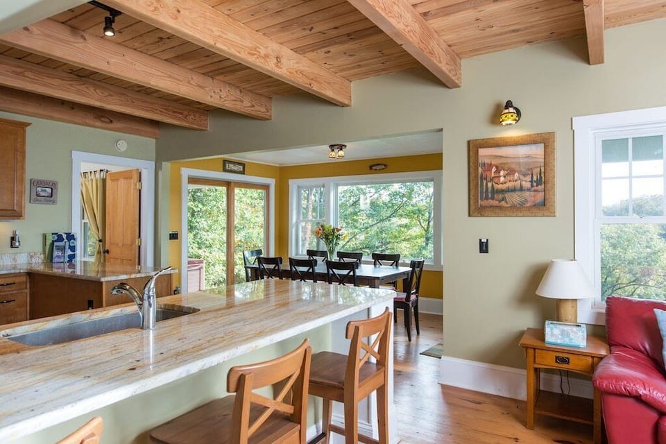 Living Room Opens to Fully Stocked Kitchen and Dining Area