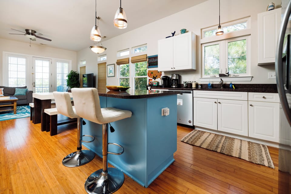 Your spacious kitchen flows into the cozy living area, creating the perfect gathering spot for morning coffee and evening conversations.