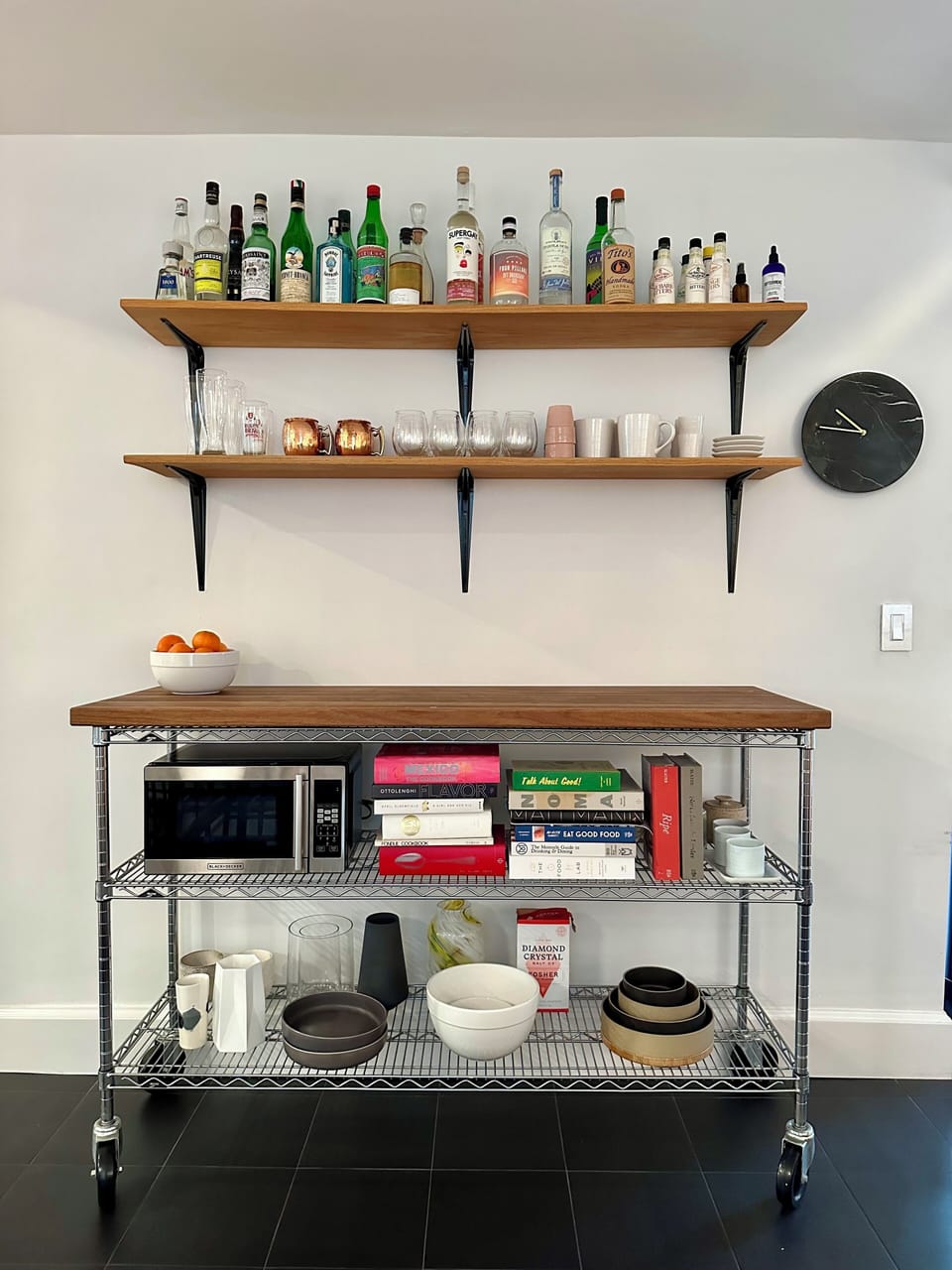 Kitchen stocked with cookbooks and honor bar.
