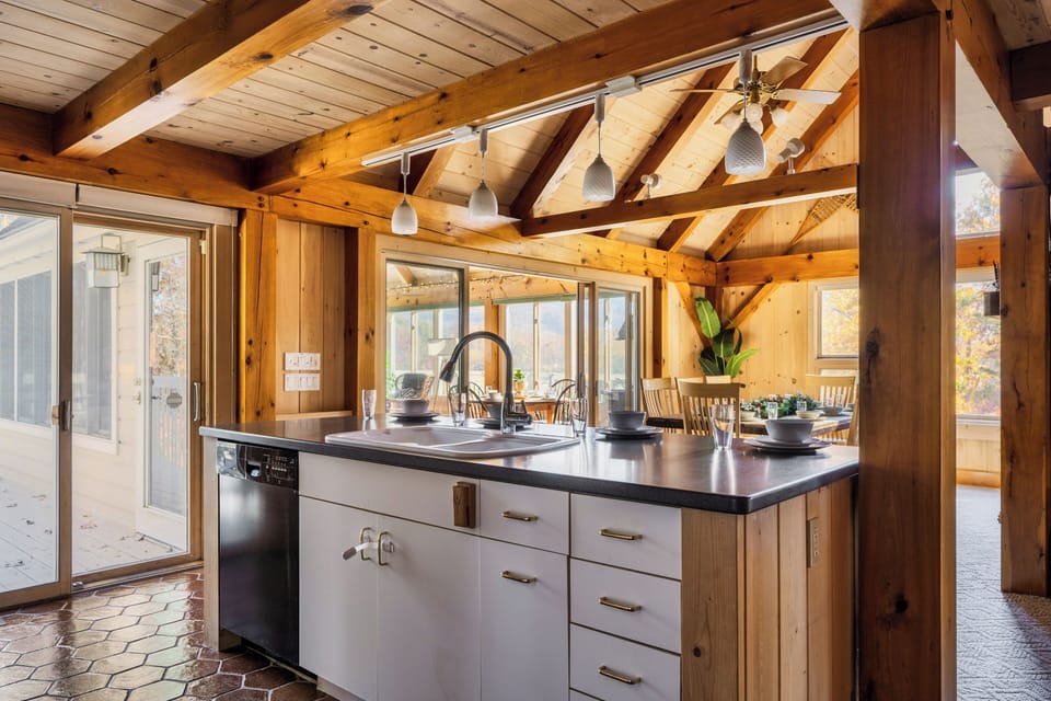 The kitchen island looking out towards the dining room and sunroom to the left. 