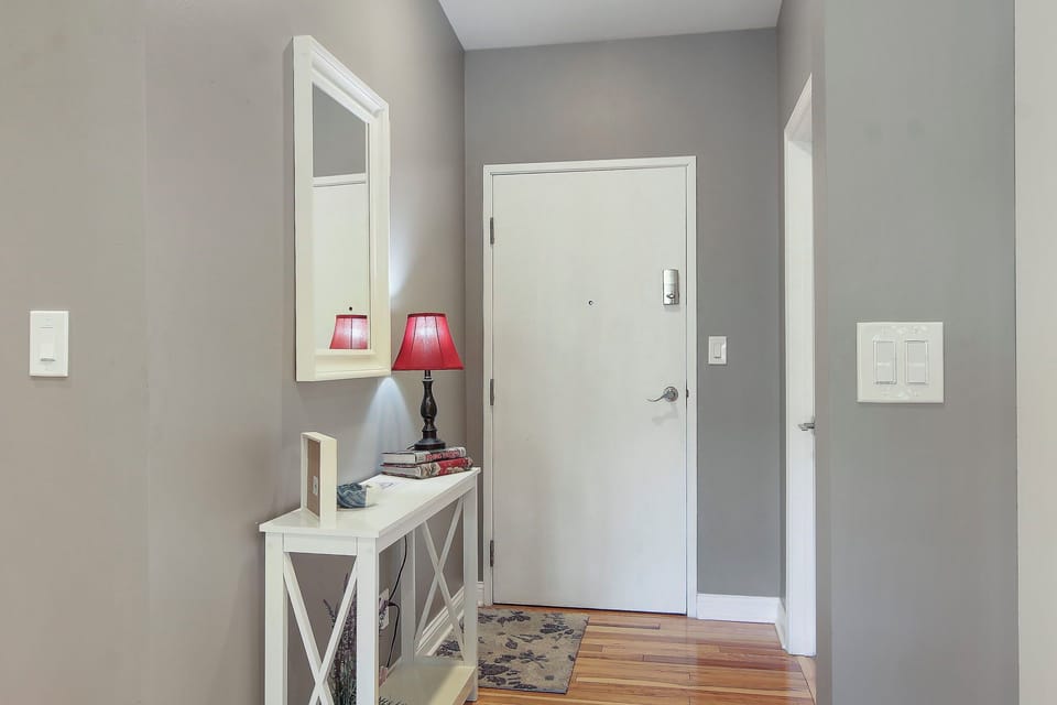 Entrance to unit with adjacent laundry room