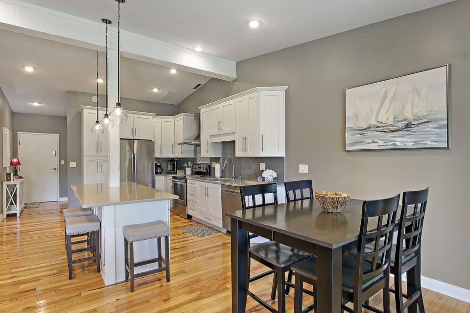 Island and dining table with seating for seven