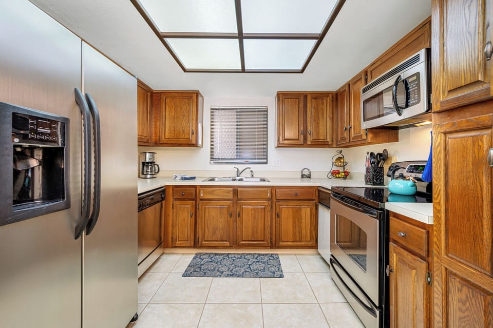 Large kitchen with stainless appliances and ice maker