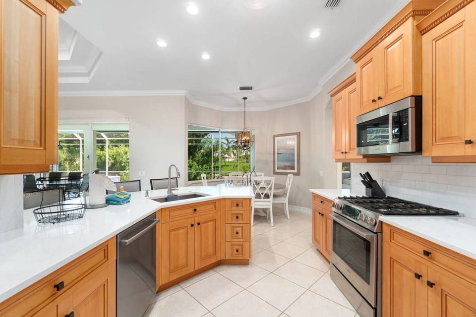 The kitchen offers ample cabinet and pantry storage