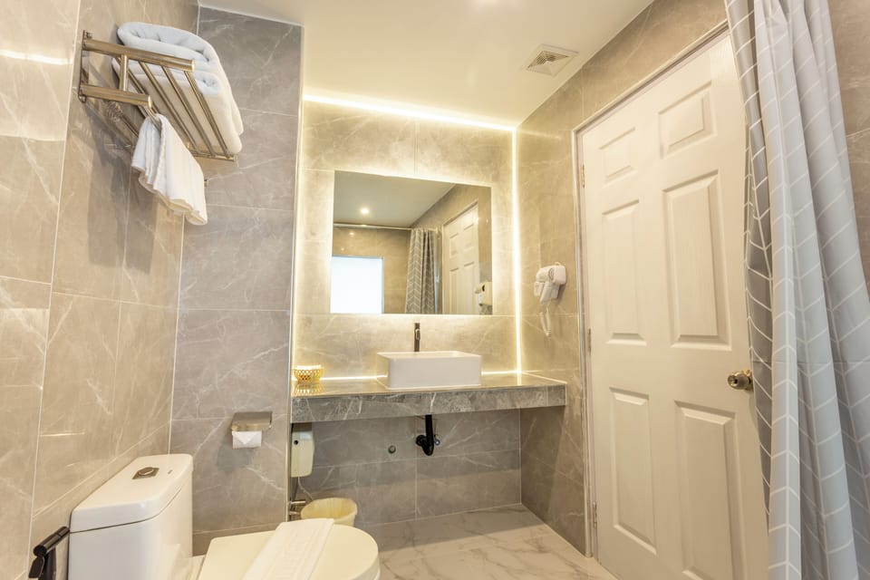 Shower, rainfall showerhead, hair dryer (on request), towels