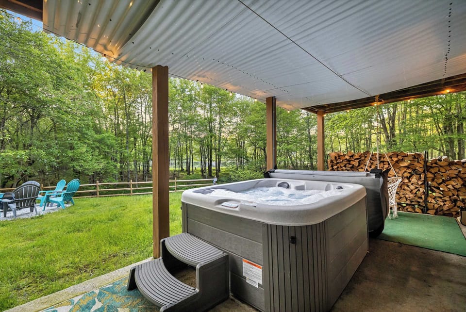 Hot Tub Retreat: Unwind in the bubbling spa surrounded by lush greenery and serene views!