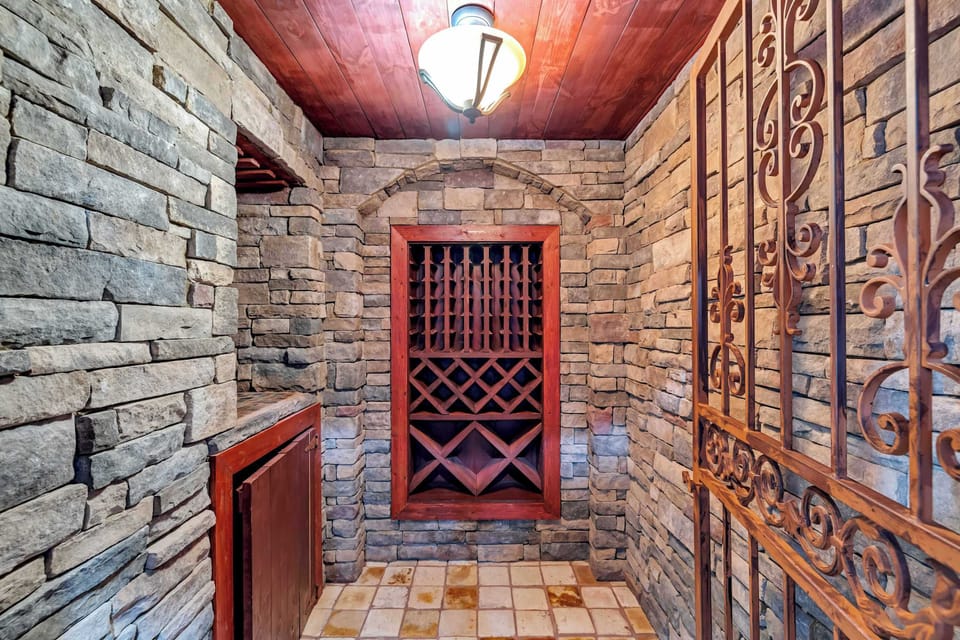 Duck behind the wrought-iron gate into the stone-walled wine cellar and pick a bottle before dinner — feels fancy without trying.