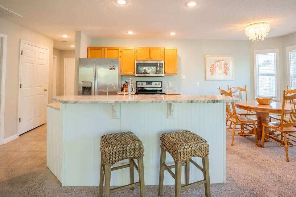 Open Floor Plan with Kitchen Island Bar Seats