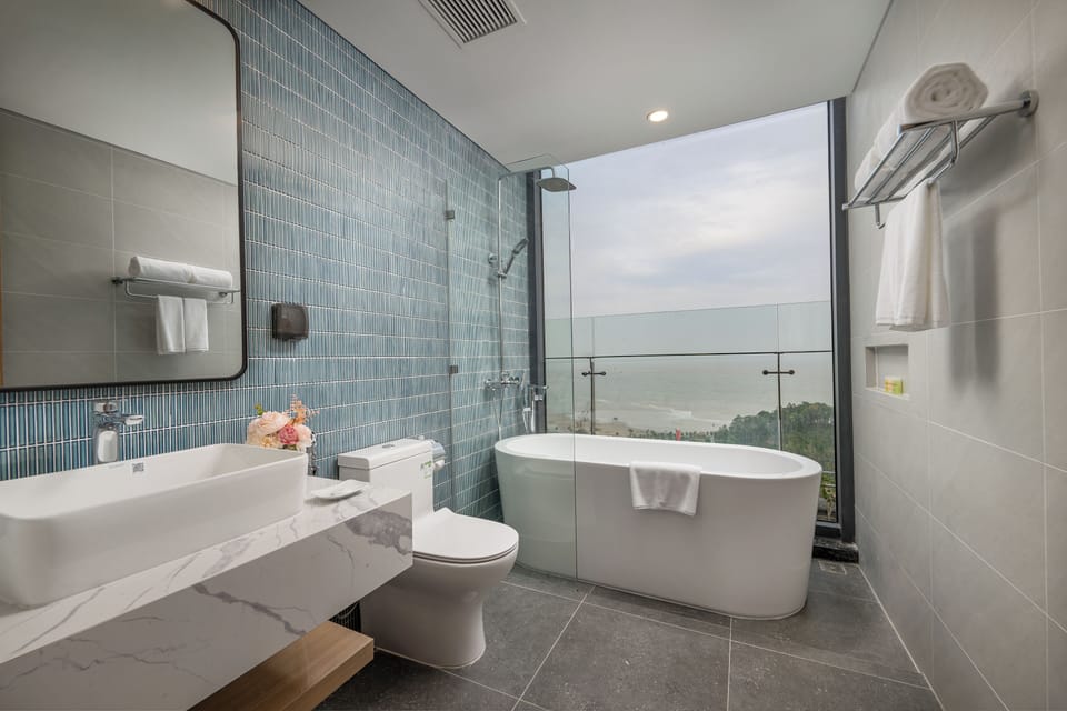 01 Premier Residence Ocean View | Bathroom | Hair dryer, slippers, towels, soap