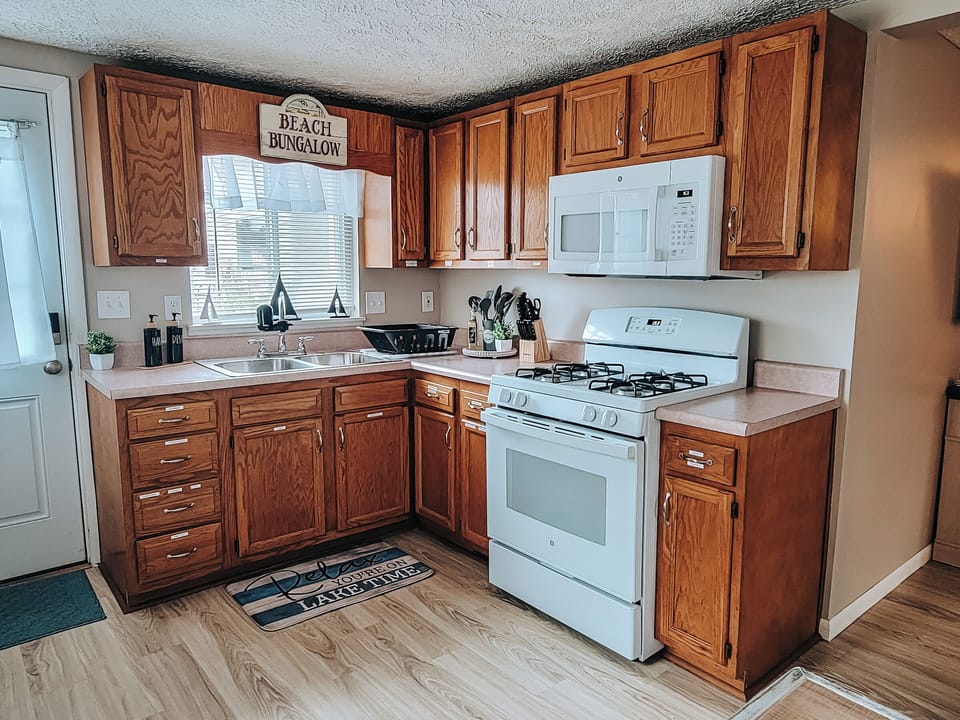 Make a meal in this fully equipped kitchen with basic spices, oil, pam, baggies.