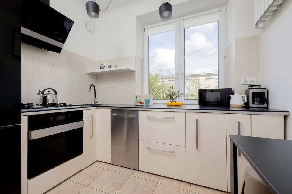 A spacious kitchen equipped with appliances, encouraging kitchen exploration.