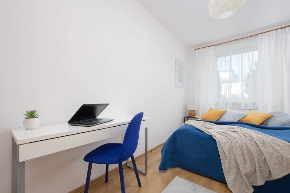 Bedroom with a desk for remote work.