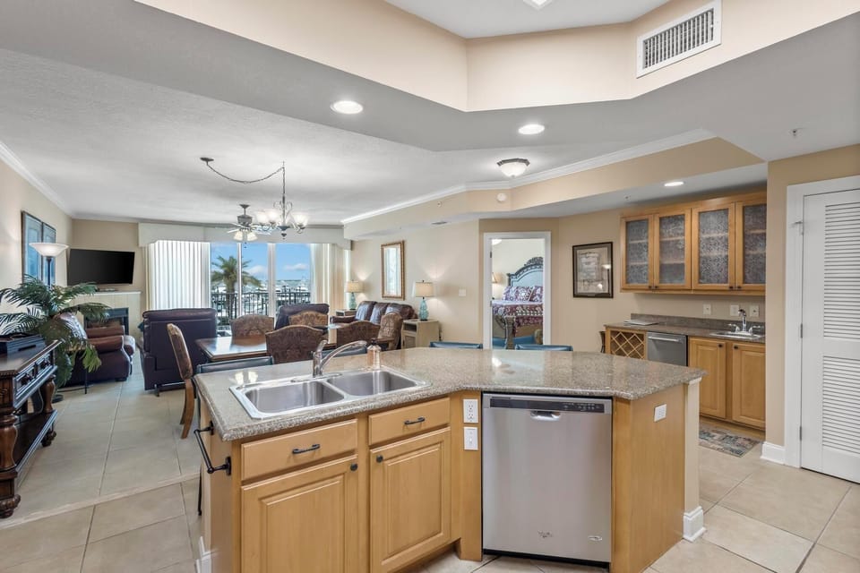 Kitchen - The open kitchen features a dishwasher, double sink and ample counter space for meal prep.