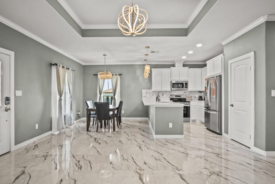 “Gather, Dine, and Make Memories – Open-concept coastal kitchen & dining space.”