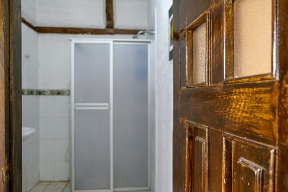 Economy Shared Dormitory | Bathroom | Shower, towels, soap, shampoo